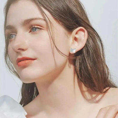 How to Elevate Your Ensemble with Butterfly Copper Stud Earrings and Stylish Black Bags